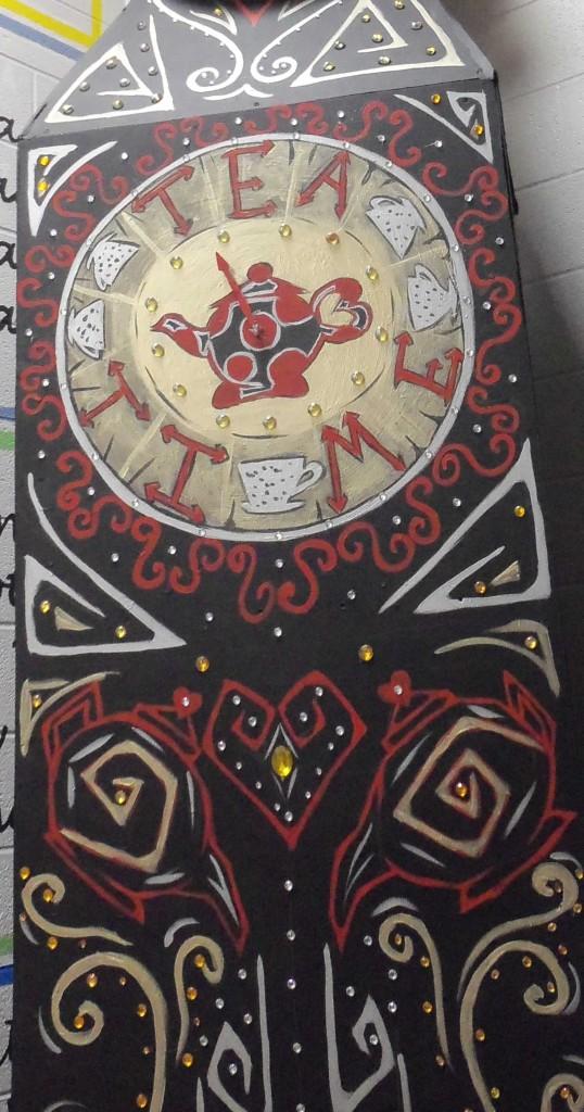 A very detailed, hand-painted clock used as scenery in the play. 