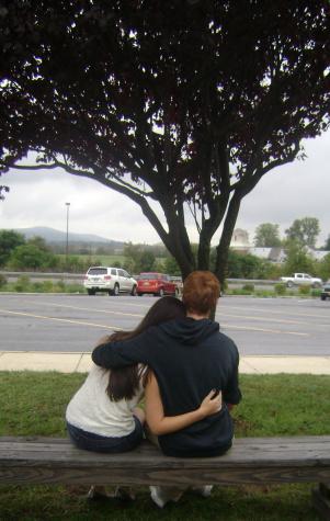 Students enjoying their date with a tree. 