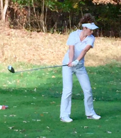 Lewis prepares to take a shot from the fairway. 