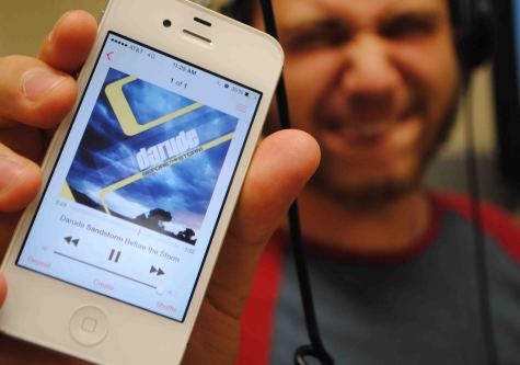 Student smiles while experiencing the electronic music of Darude.  