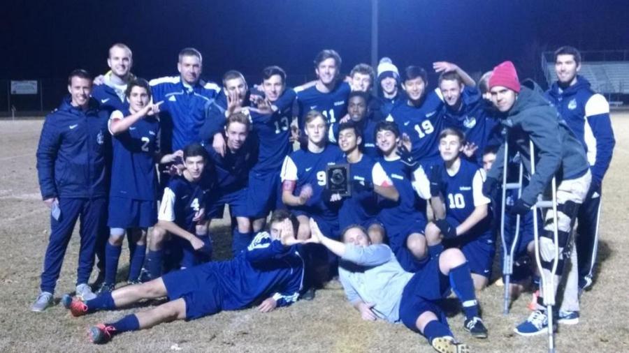 The boys varisty soccer team celebrates victory before preparing for state semis. 