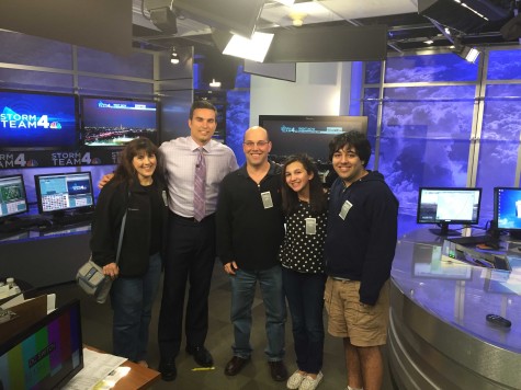 Solender and his family pose with the cast of NBC Washington news. 