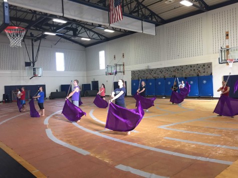 Winter Color Guard practices their performance to Dancing On My Own.