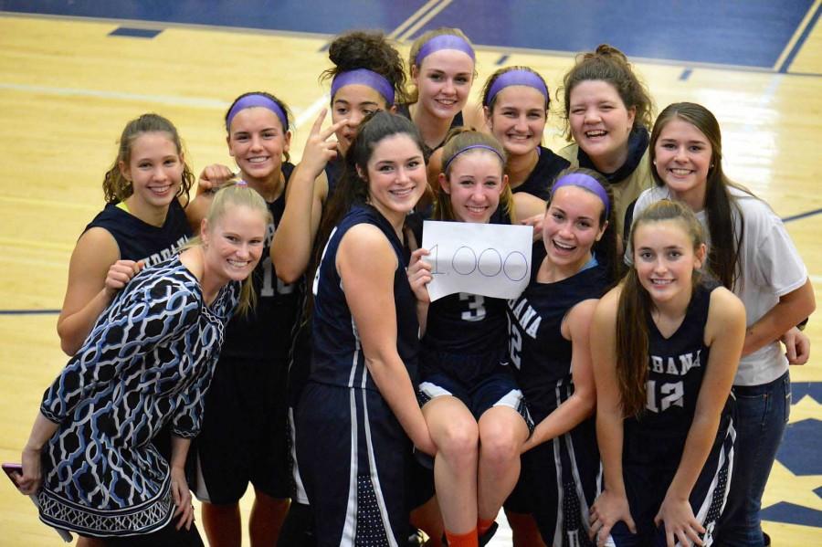 Lohr and her team  gathered together to celebrate her 1000th point milestone here at Urbana.