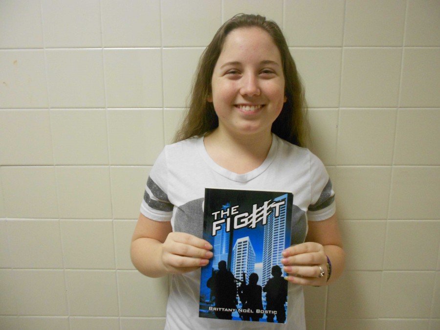 New author, Brittany Bostic poses with her new novel. 