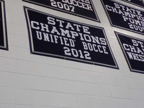 The Unified Bocce State Champions banner hangs high in the gym.