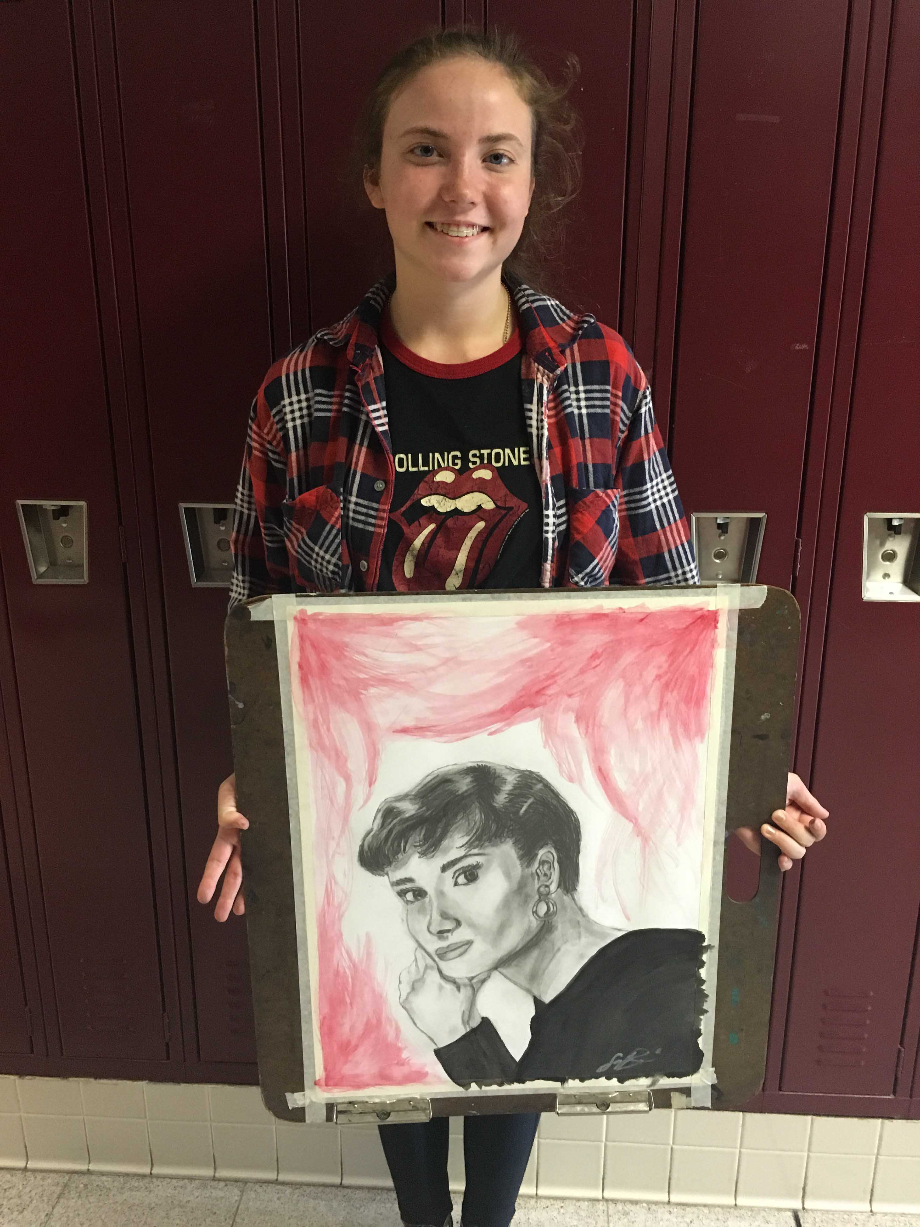 Senior Savana Bridges shows her art .