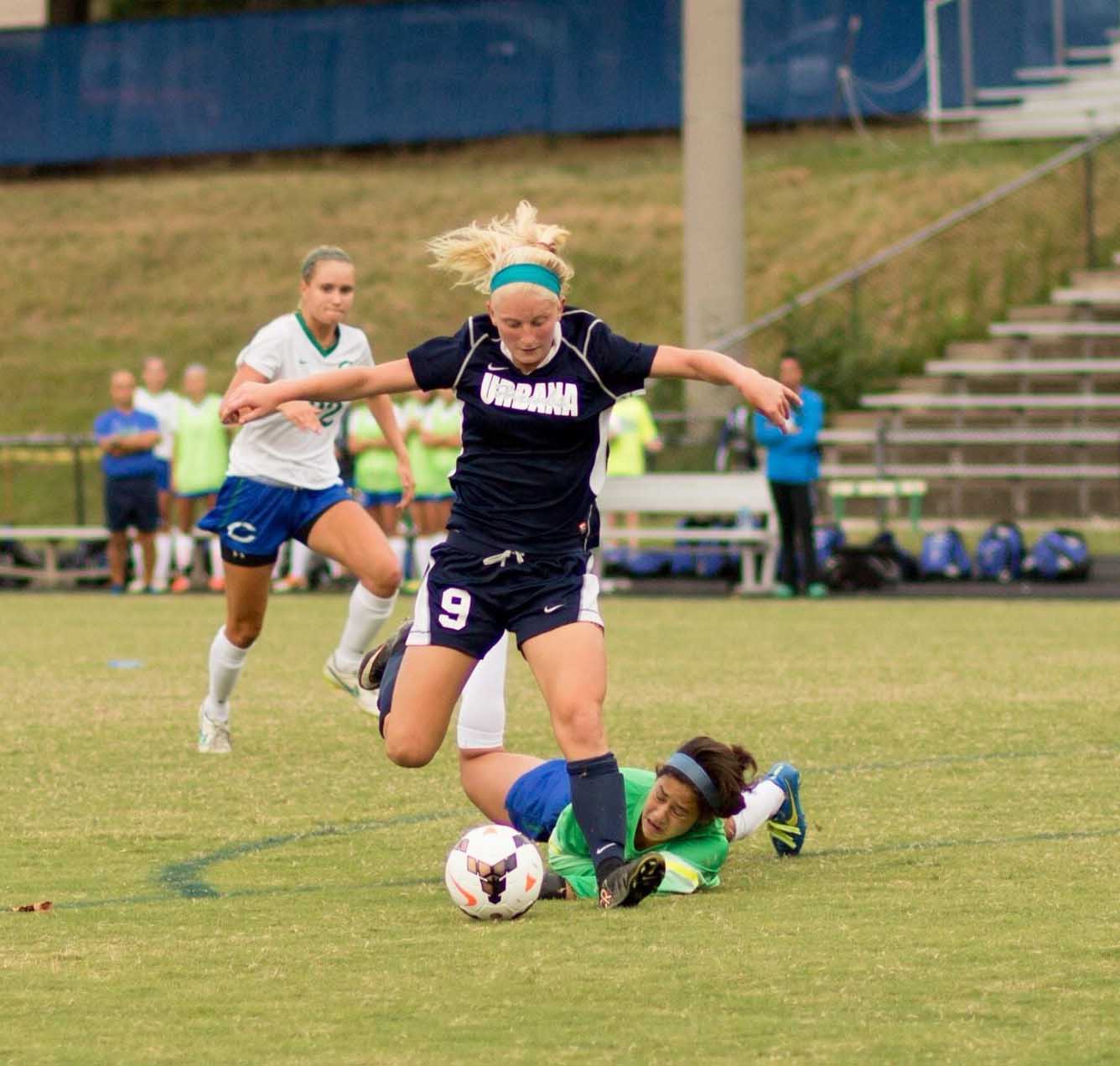 Burdette slides past the goal keeper to score a goal for the Hawks.