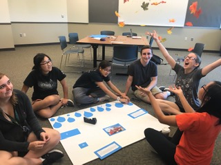 Members of the Thirst Project Club participate in creating a poster for their event at the Fall Festival. From left to right: Claire Sanford, Evelyn Sun, Calla Gentilucci, Andrew Celi, Gabi Snyder, Lily Larson