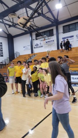 The students celebrating their win on the court