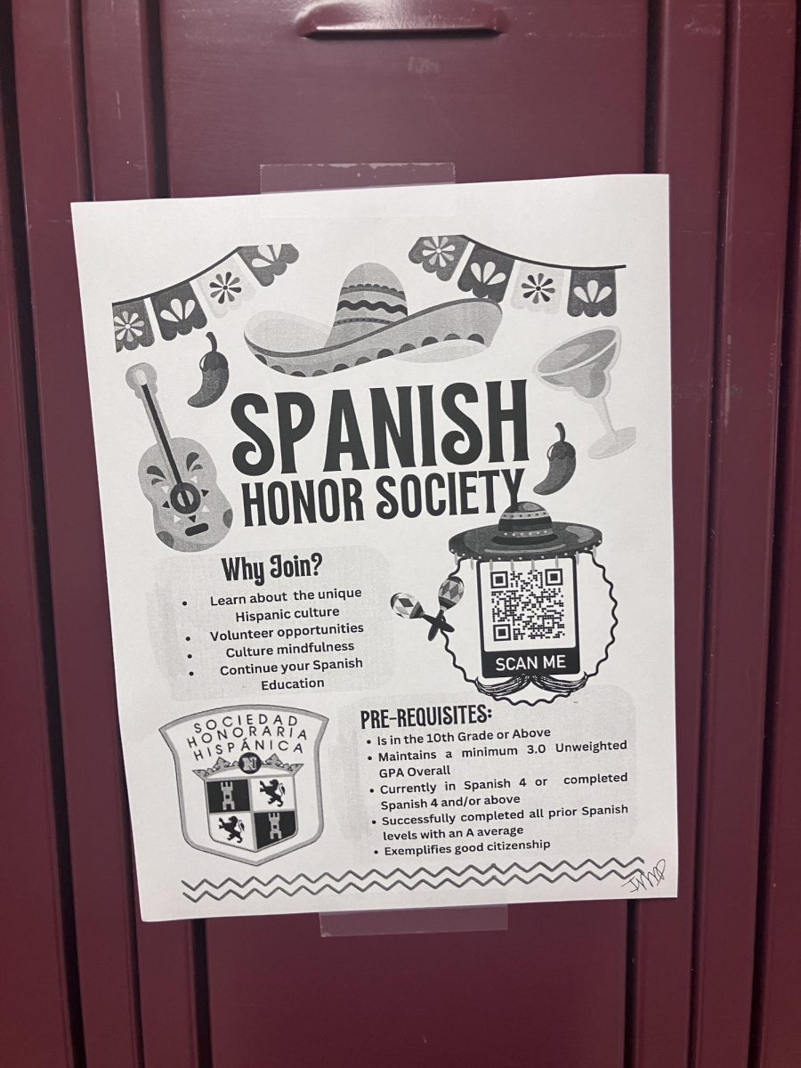 A poster of the Spanish Honor Society posted on a locker.