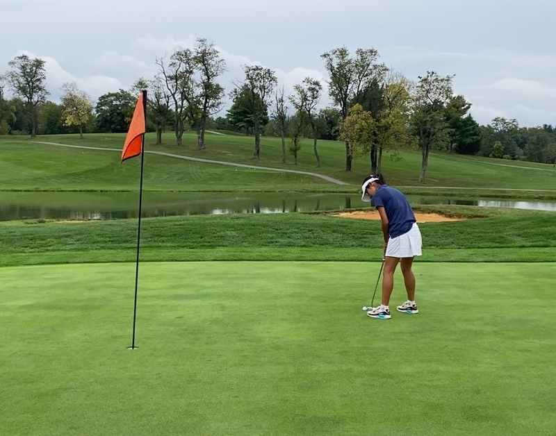 Claire Son sank her final putt, showcasing her impressive skills on the green.