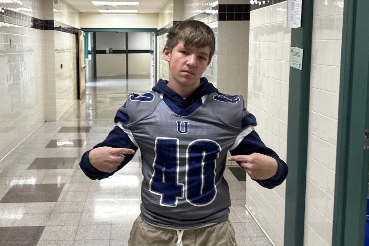 Junior Ryan Horvath shows off his Jersey during class on game day.