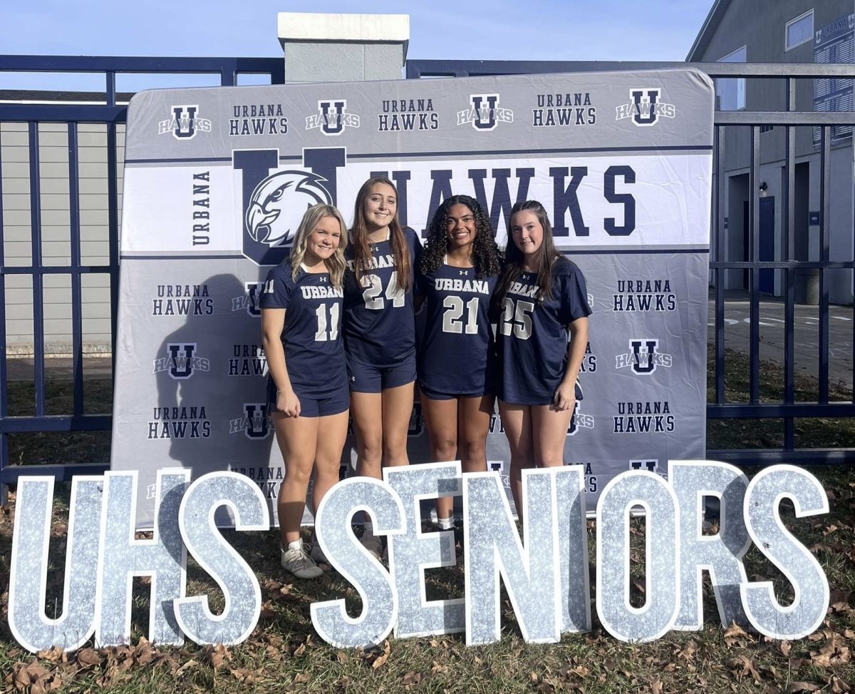 The four flag football seniors pose as they get ready for their very last home game. Pictured (L-R) Evie Raithel, Molly Warner, Keira Speikes, and Caitlyn Crotty. 