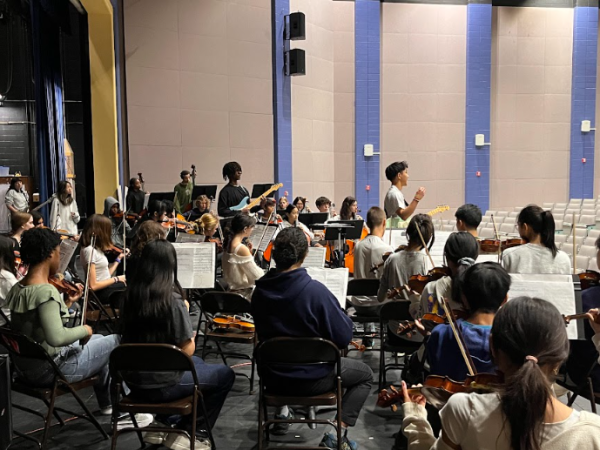 UHS orchestra students practice for an exciting evening of music.