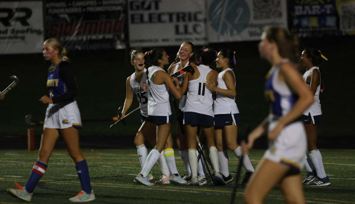 Urbana Field Hockey's team celebrate their goal in the Sally and Ella strong game against Liberty! 