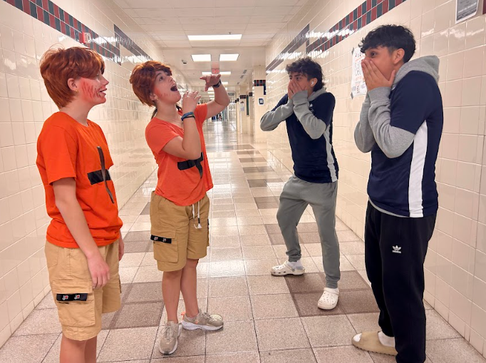 Two pom dancers dressed as Ed Sheeran for Senior Night serenade Varsity soccer players (Left to Right) Reagan Davis, Alaina Kenney, Jorge Ortega, Mateo Cornejo