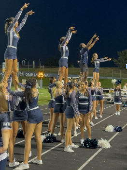 The Hawks pumping up the crowd to support the football team.