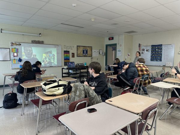 Mrs. Diggs' journalism class listens with intent to Mr. Matheny's turkey story!