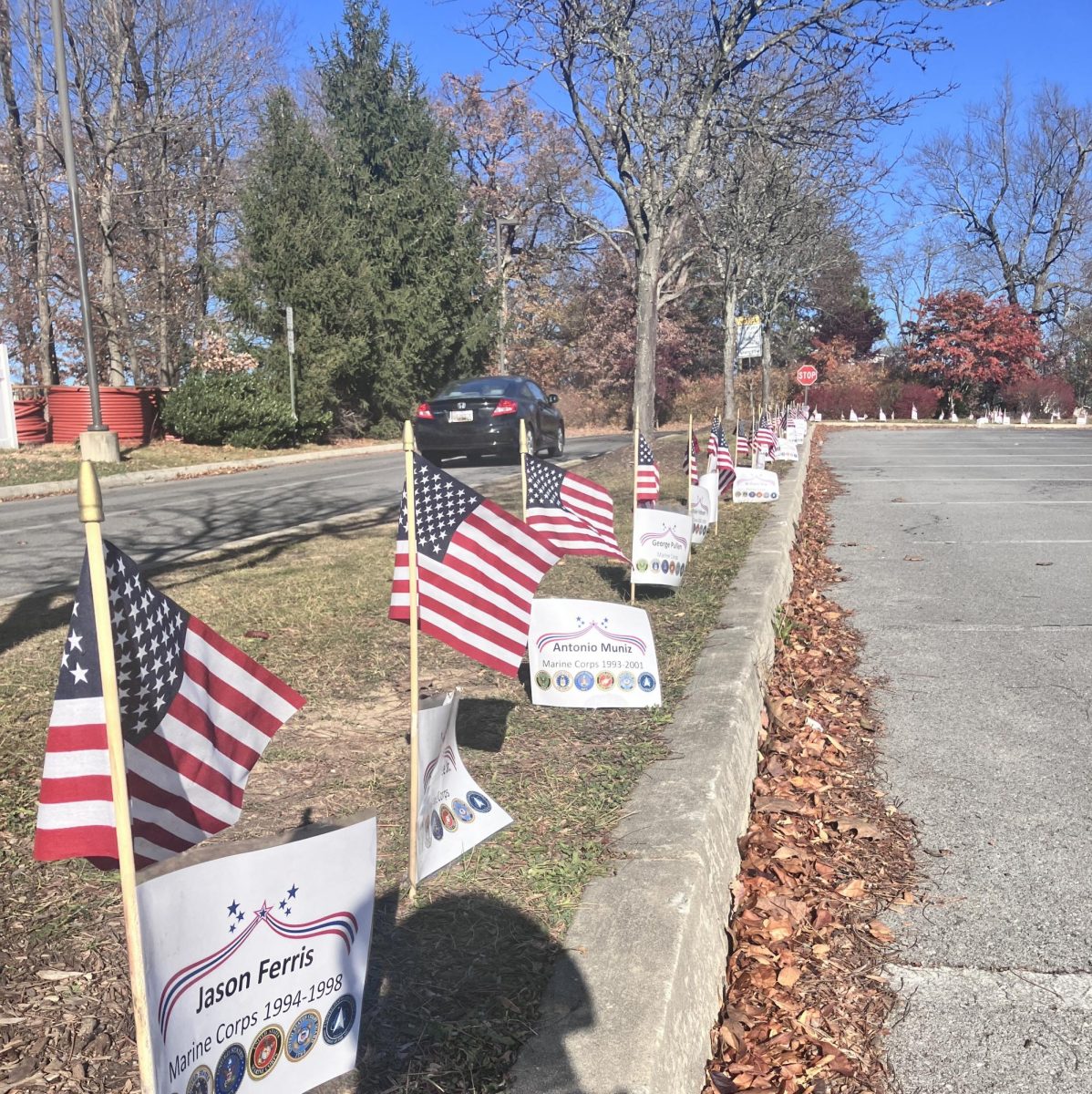 American flags bearing the names of veterans line the grounds outside Urbana Middle School.

