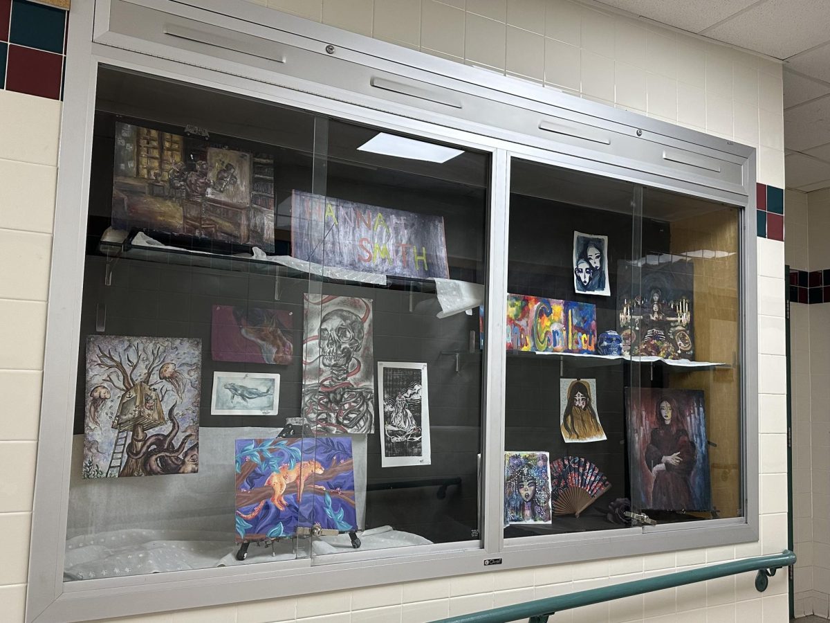 AP Studio student art is displayed outside of Ms. Willett's classroom brighten up the halls!