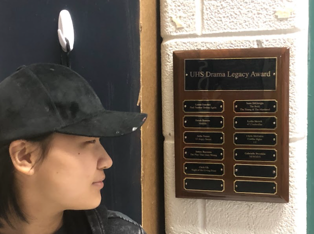 Legacy Award recipient Chris Oh looks at his brand new plaque in Mr. Stephen Ward's classroom.