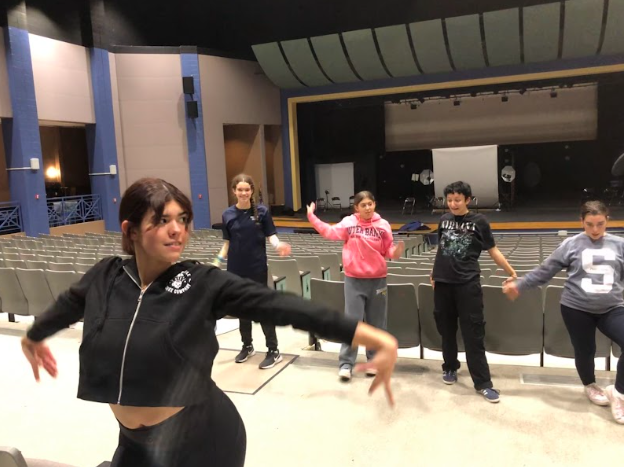 UHS Drama students Bella Medina, Sofia De Moura, Mia Mazaika, Maverick Breuker, and Ella Saulsbury practice the ITS dance, "Dance the Night Away," for Broadway Backwards.