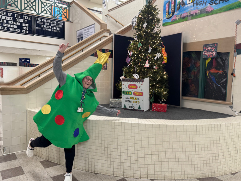 Ms. Krista Day (Instructional Assistant) celabrates her winter spirit in her Christmas tree costume.