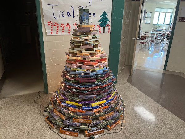 The book tree organized and built by the National English Honor Society opens Urbana's arms for the holiday season. 