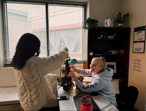 Holiday Spirit Shines as Hannah Milor and Mrs. G Decorate Classroom Tree