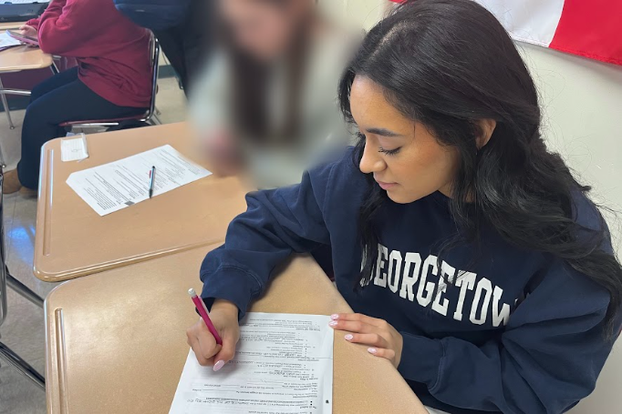 Sophia Hernandez, class of 2026, studying before leaving for her track meet.