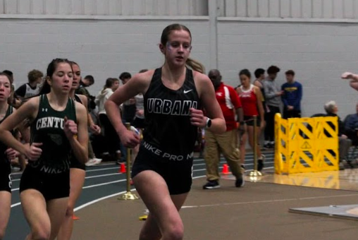 Kate Miner races to the finish line during the Dwight Scott Invitational meet.