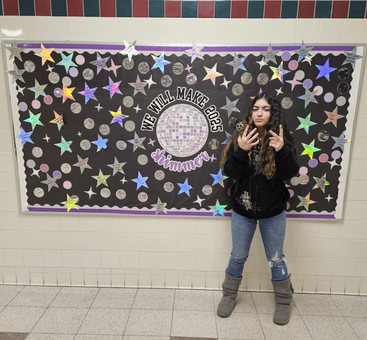 Class of 2028 Nyla Rahim introduces the UHS "We Will Make 2025 Shimmer" poster.