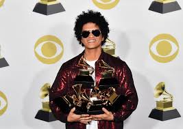 This photo shows Bruno Mars Holding 5 Grammy awards
Credit: Getty Images
Website: The Daily Record