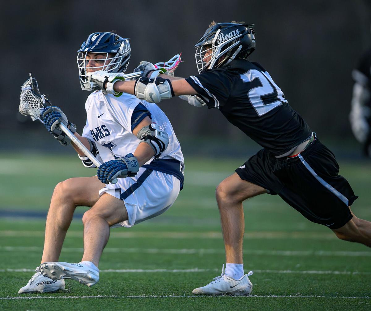By : Greg Swatek 
Via : Frederick News Post
Urbana's Cam Connors gets checked by Oakdale's Tyler Spencer in the second quarter of Tuesday's lacrosse match at Urbana High School.