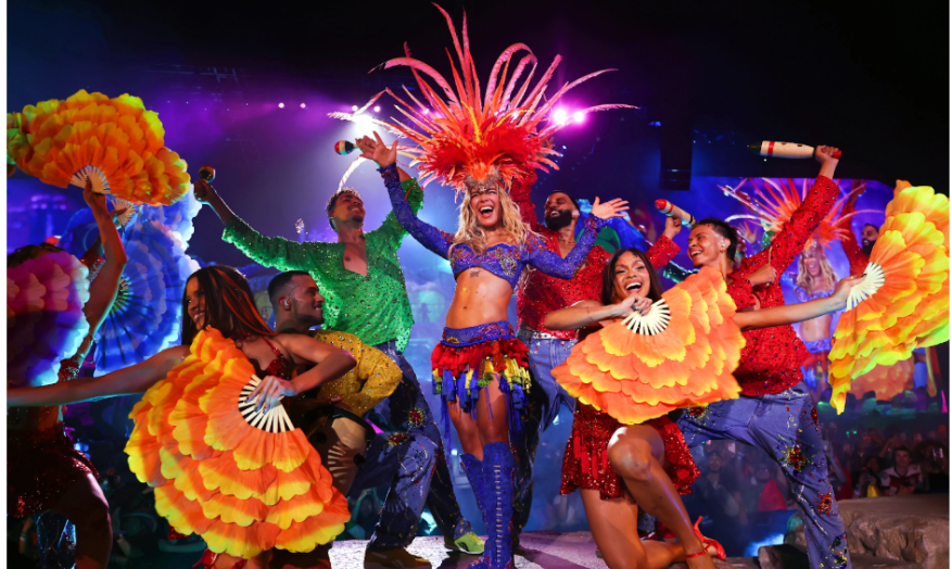 In this photo by Kevin Mazur via Getty Images, Karol G is captured  during her historic headlining performance at the Coachella Valley  Music and Arts Festival in April 2026